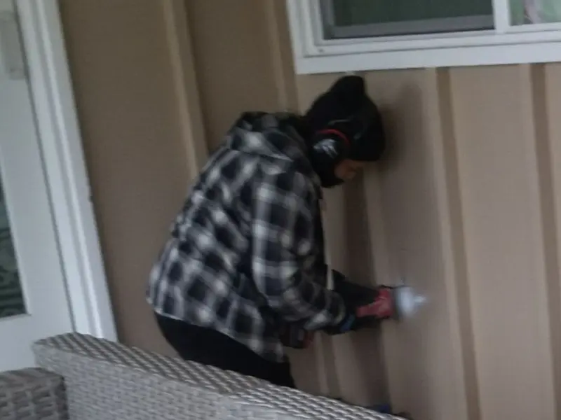 Professional electrician installing an exterior outlet in Nazareth