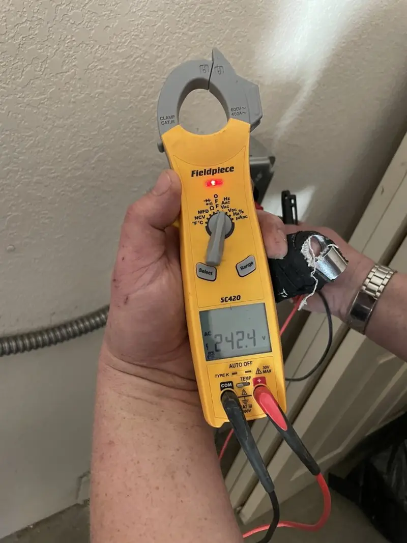 Voltage testing with clamp meter during Outlet Installation in Nazareth
